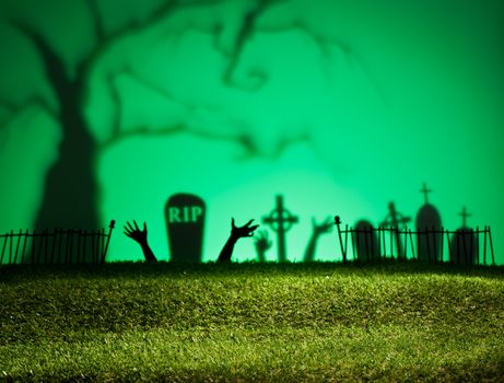 Halloween landscape with tree graveyard and green grass