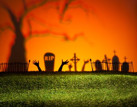 Halloween landscape with tree graveyard and green grass