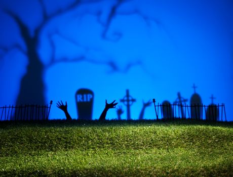 Halloween landscape with tree graveyard and green grass