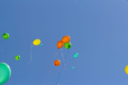 color balloons flying to the sky