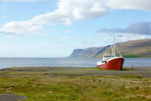 An old fishing vessel that shipwrecked on the northern coast of Iceland in the Westfjords region