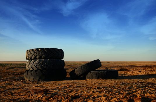 Photo of five old vehicle tires outdoors