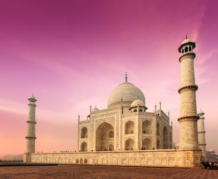 Taj Mahal on sunrise. Indian Symbol - India travel background. Agra, India