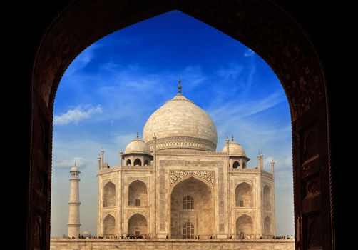 Taj Mahal through arch, Indian Symbol - India travel background. Agra, Uttar Pradesh, India