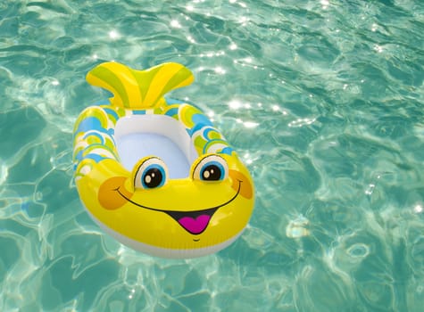 Bright kid's swimming toy in the pool 