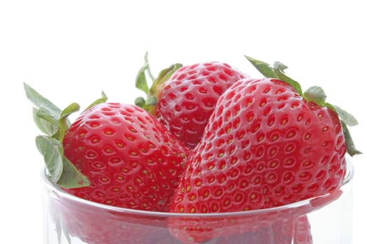 close up of strawberries in a glass