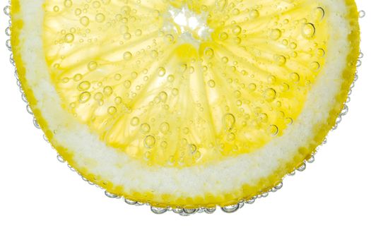 Lemon Slice in Clear Fizzy Water Bubble Background Isolated