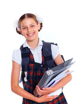 Education theme. Joyful schoolgirl smiling happily holding book