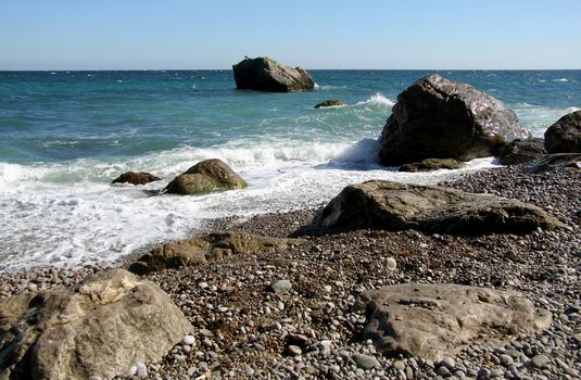 Marine rocky shore of Black sea with pebbles