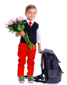Happy schoolboy with flower and backpack isolated on white background