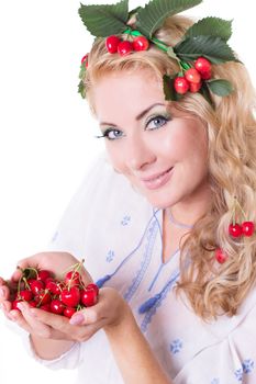 Sensual woman with cherries in hands and hair isolated over white