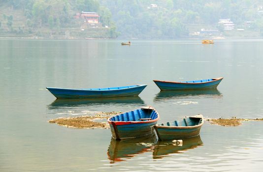 Boats on Phewa lake in Pokhara, Nepal 