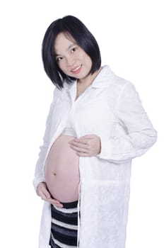 Beautiful pregnant woman expecting isolated over white background