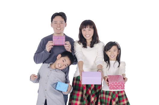 family smiling holding gift