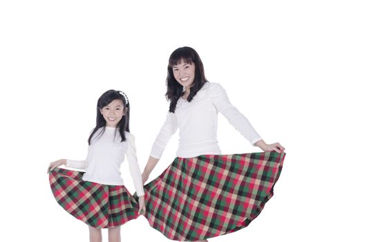 Happy mother and daughter over white background