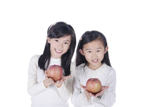 Cute children holds an apples over white background