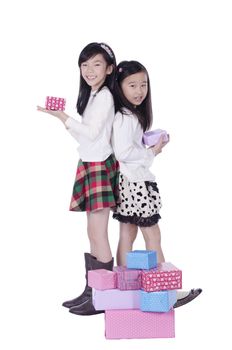 Two pretty girls get gifts on white background