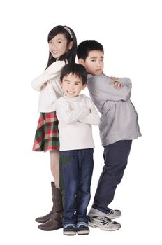 Three cute children posed over white background