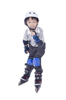 Smart boy playing roller blades over white background