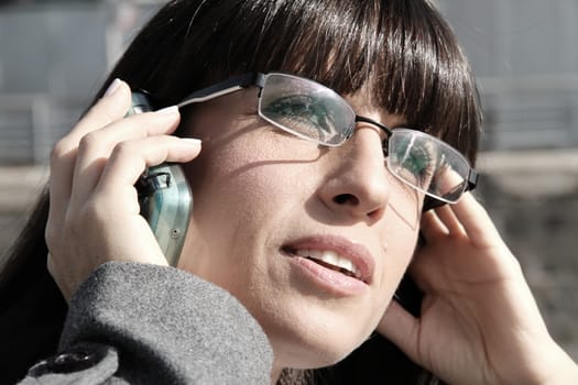 A business woman talking on the cell phone.