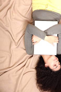 A young adult woman with a Laptop.