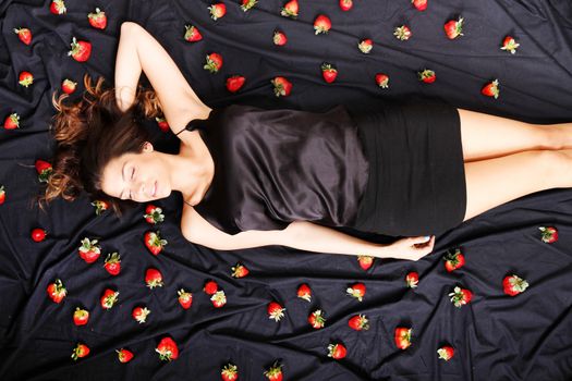 A young adult american woman dreaming of strawberries.