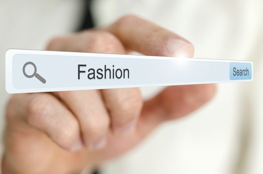 Word Fashion written in search bar on virtual screen.