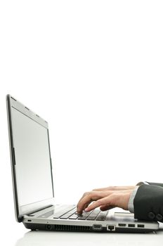 Closeup of business man hands typing on laptop.
