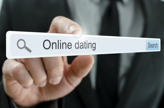 Online dating written in search bar on virtual screen.