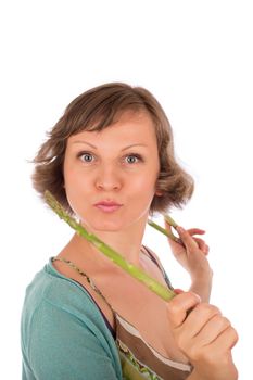 Portrait of naughty woman holding fresh green asparagus. Isolated on white background.