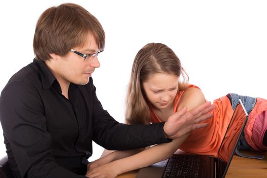 Father hides the screen of his laptop with his hand to his daughter who tries to watch what he do. Isolated on white background.