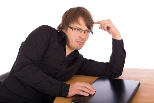 Business man sitting at a table and think seriously about a business idea. Isolated on white background.