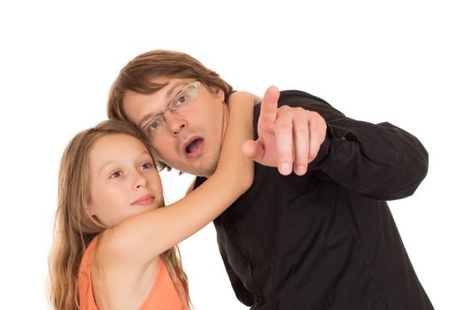 Surprised father shows something to his daughter who are not afraid in his arms. Isolated on white background.