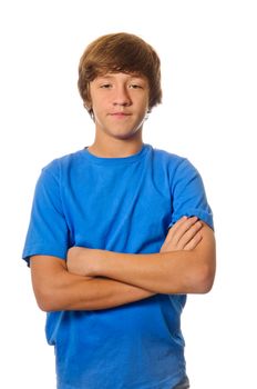 Young teen caucasian boy with arms crossed isolated on white background.