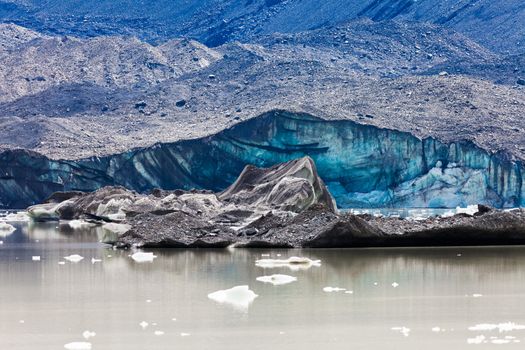 Tasman Glacier ends at Lake with floating icebergs in Aoraki Mount Cook National Park on South Island of in New Zealand