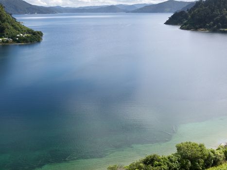 Mirrored clouds on calm surface of Lake Waikaremoana in Urewera National Park in Hawke's Bay district of North Island of New Zealand.