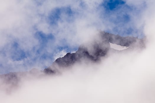 Clouds lifting on rocky mountain peaks in Aoraki Mount Cook National Park South Island New Zealand