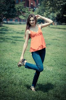 beautiful model young woman in the park in spring