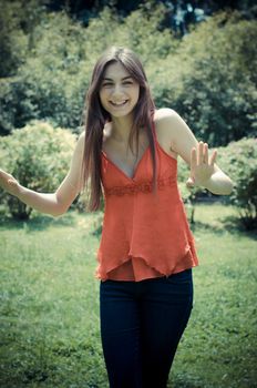 beautiful model young woman in the park in spring