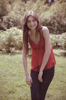 beautiful model young woman in the park in spring