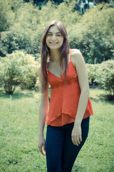beautiful model young woman in the park in spring