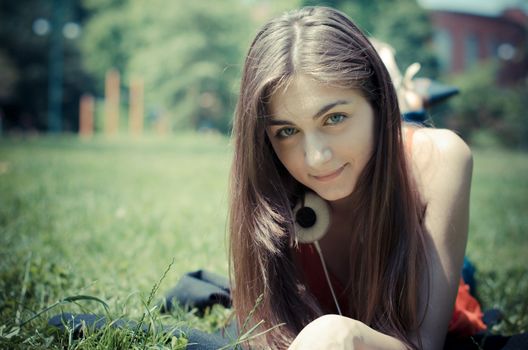 beautiful model young woman in the park in spring