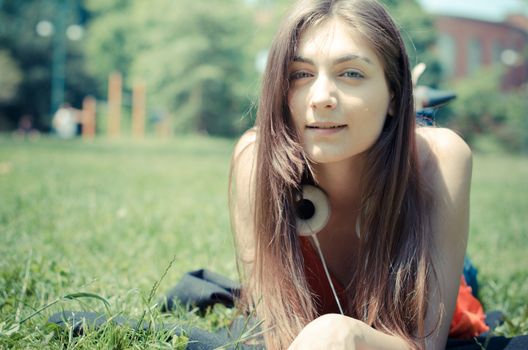 beautiful model young woman in the park in spring