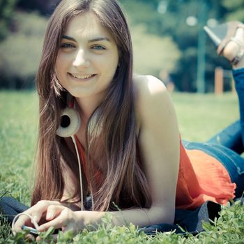beautiful model young woman in the park in spring