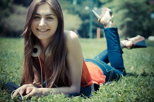 beautiful model young woman in the park in spring
