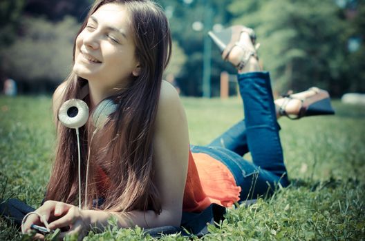 beautiful model young woman in the park in spring