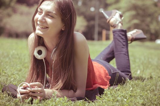 beautiful model young woman in the park in spring