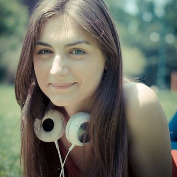 beautiful model young woman in the park in spring