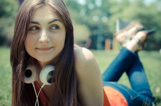 beautiful model young woman in the park in spring