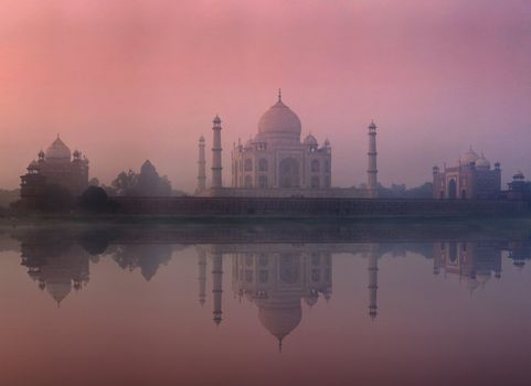 Taj Mahal on sunrise sunset reflection in Yamuna river panorama in fog, Indian Symbol - India travel background. Agra, Uttar Pradesh, India